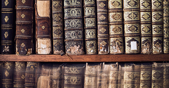 antique-books-on-a-library-shelf