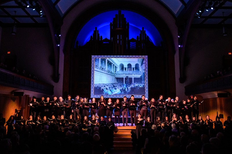 Student choir performing on stage of Jeanne Lamon Hall. Photo by Dahlia Katz.