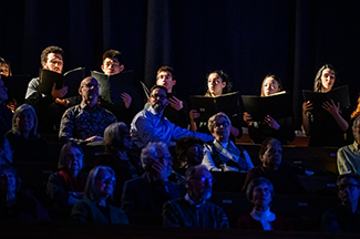 Student choir performing on stage of Jeanne Lamon Hall. Photo by Dahlia Katz.