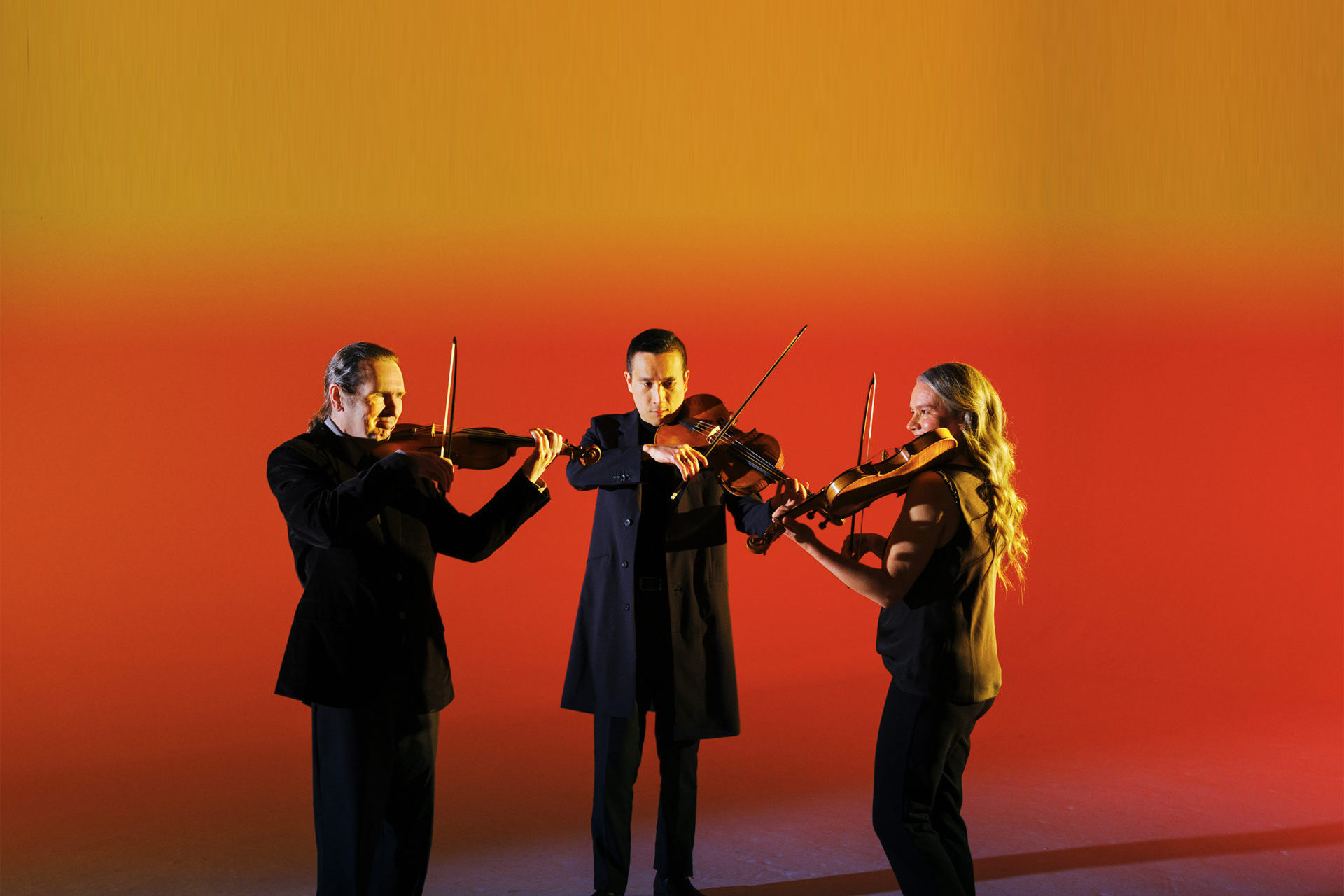 Three musicians performing